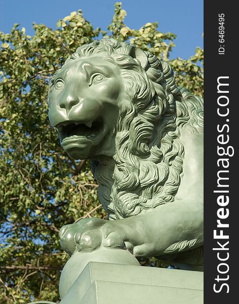 Head of a stone lion on a pedestal