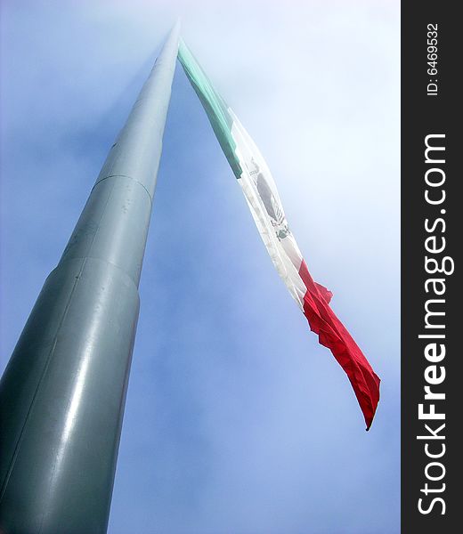 300 feet tall Mexican flag in a foggy sky (Ensenada, Mexico).