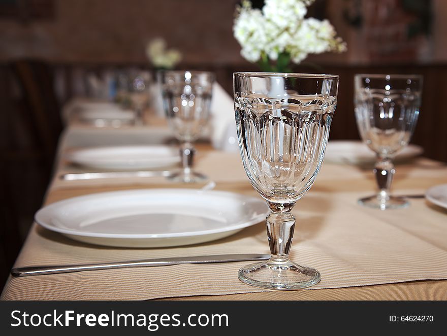 Glasses And Plates On Table