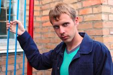 Young Stylish Man Stand Near Brick Wall. Stock Photography Young Stylish Man Stand Near Brick Wall. Stock Photography