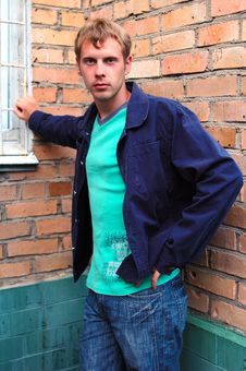 Young Stylish Man Stand Near Brick Wall. Royalty Free Stock Photos Young Stylish Man Stand Near Brick Wall. Royalty Free Stock Photos
