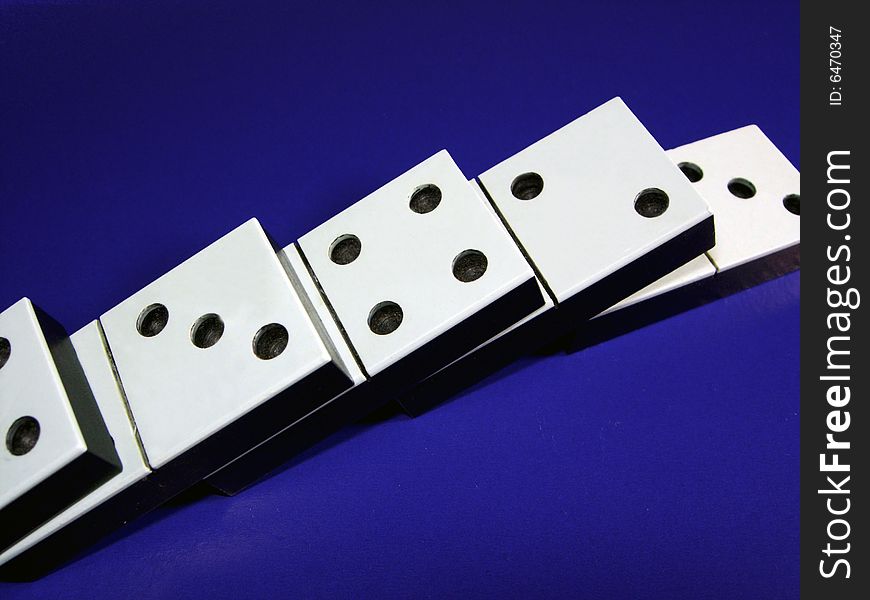 Dominoes on a dark blue background