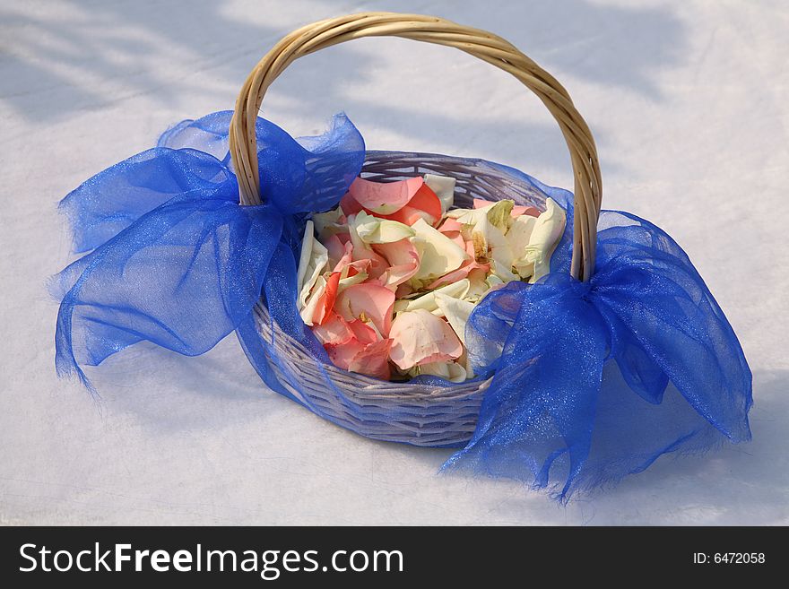 A wedding flower girl's basket with petals. A wedding flower girl's basket with petals.