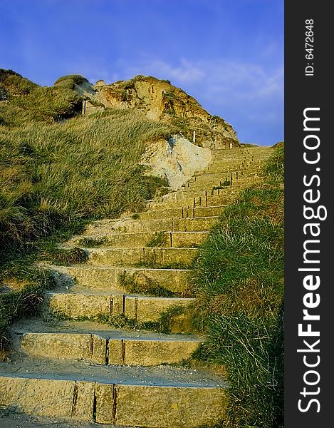 Old stone steps situated near a beach in Weymouth UK. Old stone steps situated near a beach in Weymouth UK.