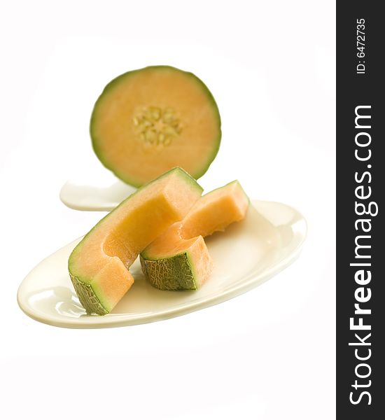 Delicious cantaloupe melon sliced on a plate.