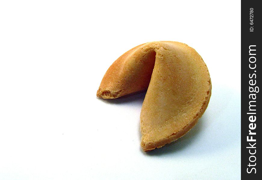 A traditional fortune cookie on a white background