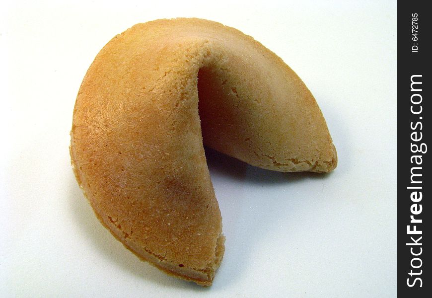 A traditional fortune cookie on a white background