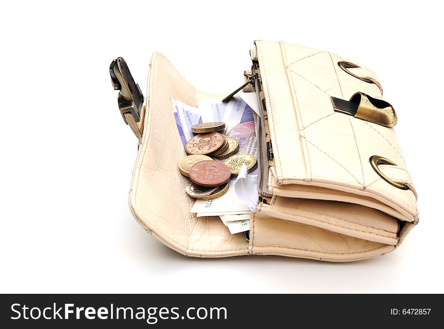 Purse with notes and coins in on white. Purse with notes and coins in on white