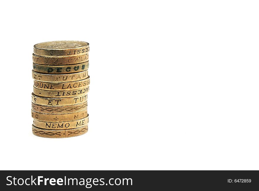 A stack of pound coins on a white background. A stack of pound coins on a white background