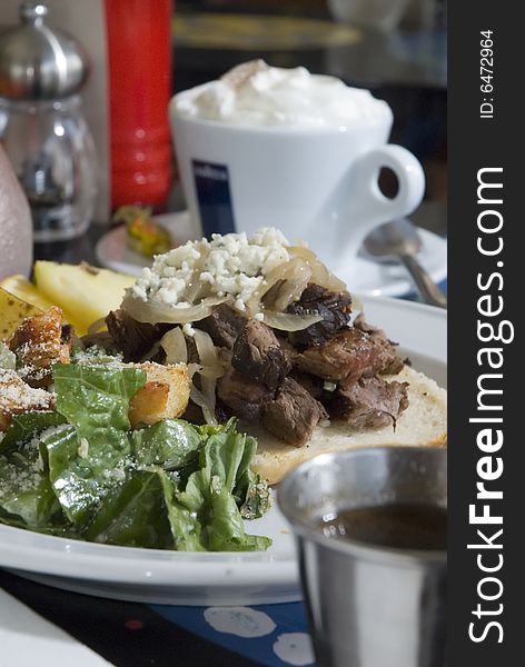 Chopped steak with onions and caesar salad. Chopped steak with onions and caesar salad