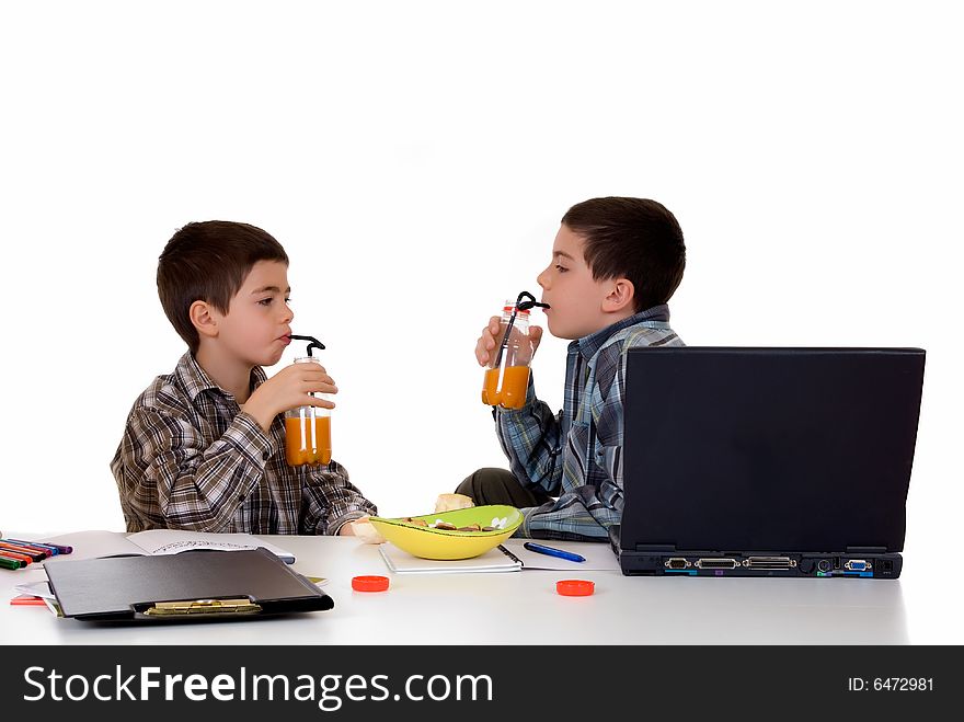 Two young boys doing together studying and homework. Two young boys doing together studying and homework