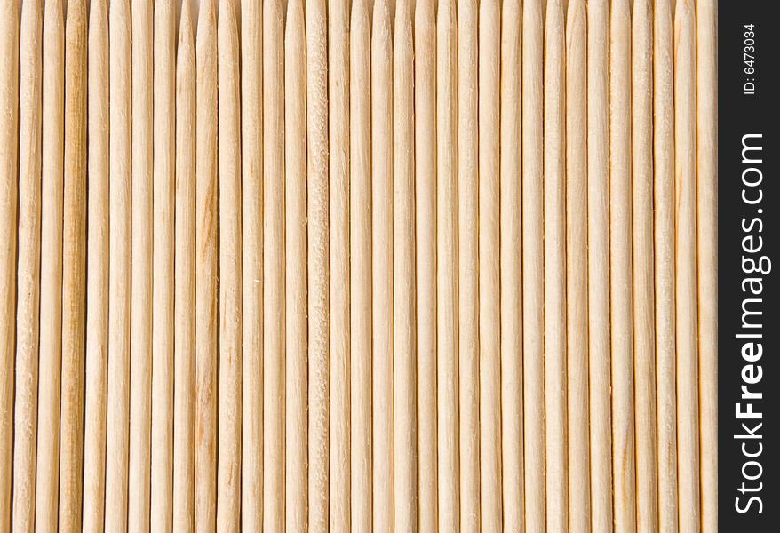 Background of wooden toothpicks closeup