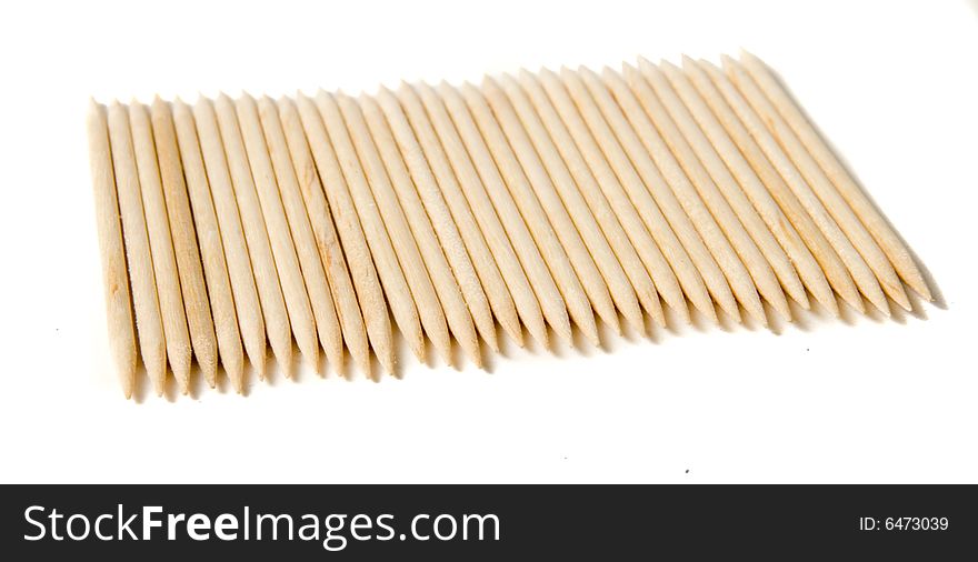 Group of toothpicks on white ground