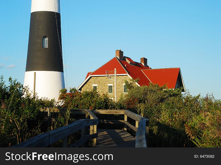 This is a shot of a lighthouse on Fire Island located off the coast of Long Island in New York state. This is a shot of a lighthouse on Fire Island located off the coast of Long Island in New York state.