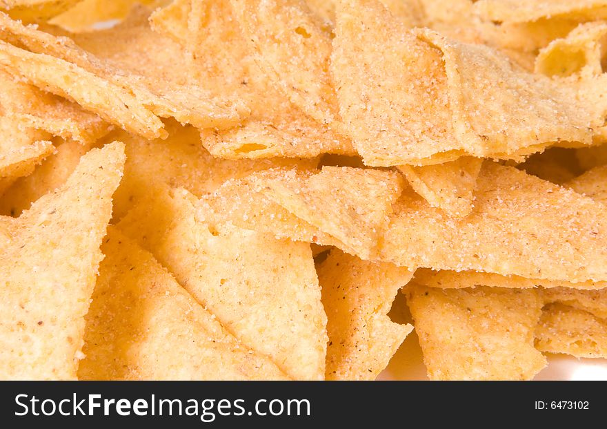 Background of salty yellow nachos