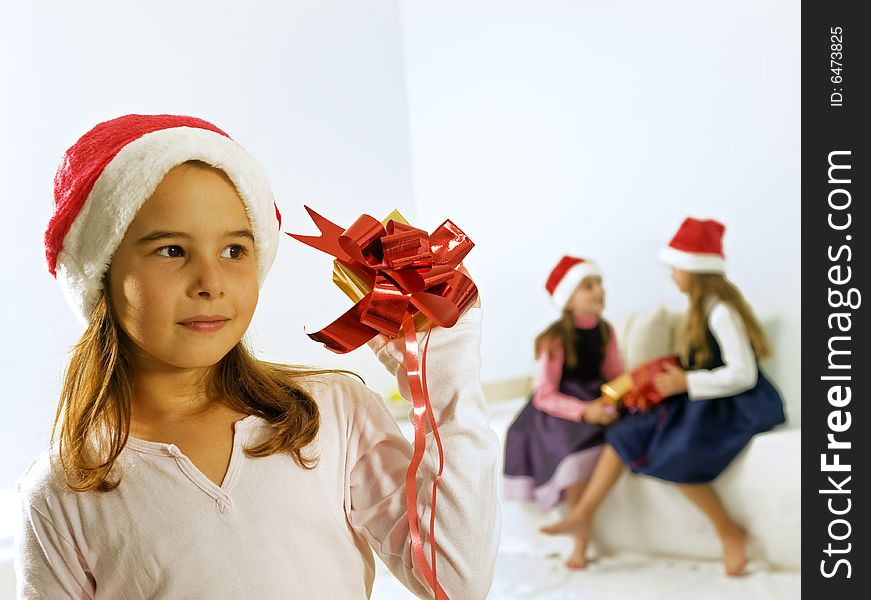 A little girl happy after receiving a present. A little girl happy after receiving a present