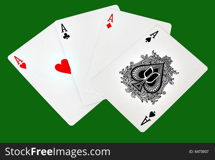 Four aces isolated in a green background with clipping path. Four aces isolated in a green background with clipping path