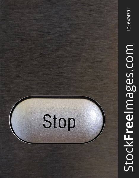 A stop button on a textured grey background. Space for text on the background.