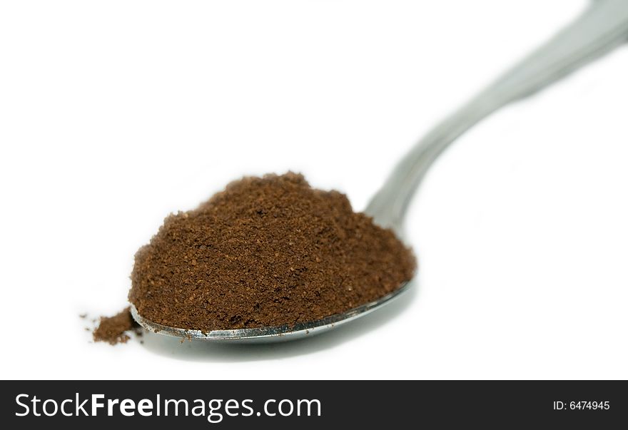 Milled coffee in a spoon. Milled coffee in a spoon