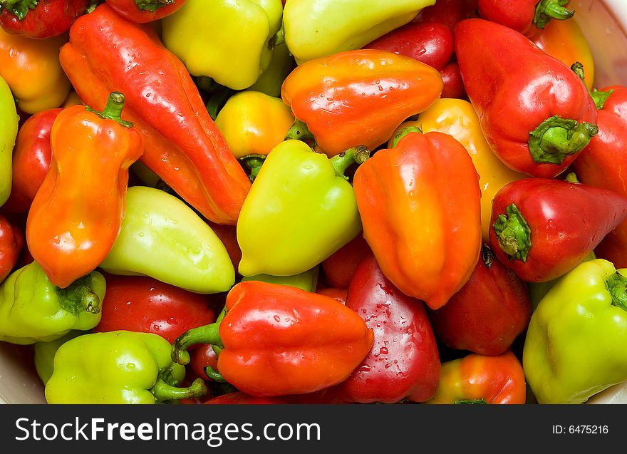 Background with many colored sweet peppers
