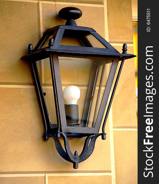 A good close up of a lamp on a wall