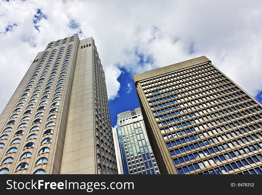 Skyscrapers in downtown montreal on a beautiful cloudy sky