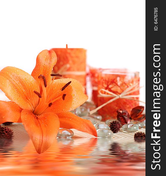 Orange lilly flower and candles. Orange lilly flower and candles