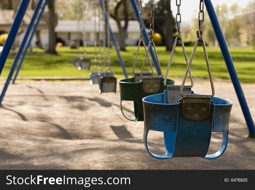 Lonely park swings, where are the kids?