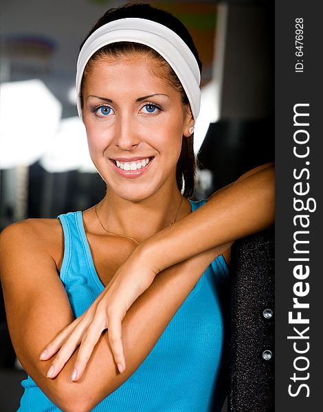 Attractive young woman in health club with a happy smile. Attractive young woman in health club with a happy smile