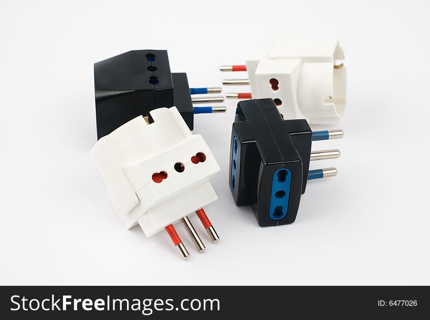 Electrical triple plugs on white background