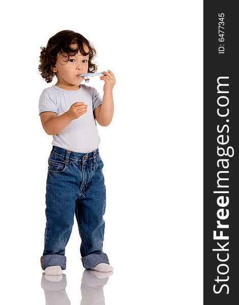 Child with toothbrush on white