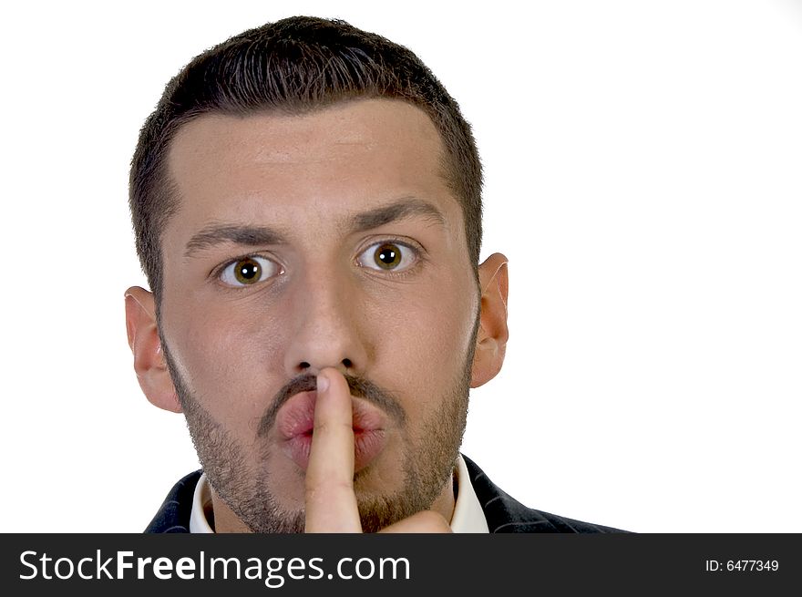 Man instructing to be silent with white background