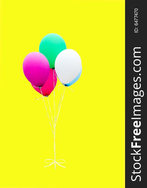 Balloons are on the yellow background