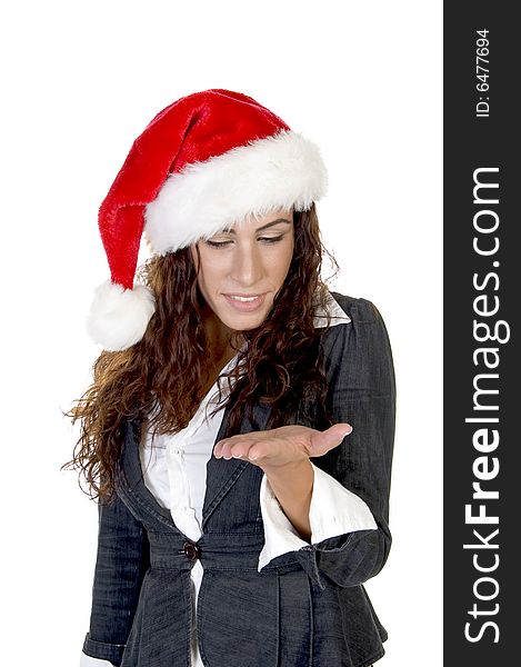Lady in christmas cap looking her palm on an isolated background