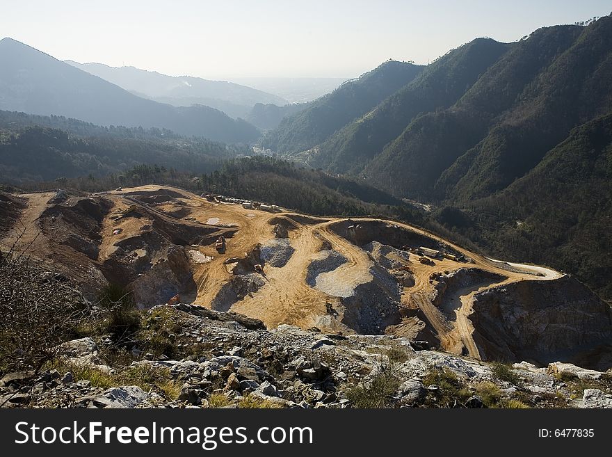 Gravel pit on the Alpi Apuane in front of Mar tirreno;panoramic view. Gravel pit on the Alpi Apuane in front of Mar tirreno;panoramic view