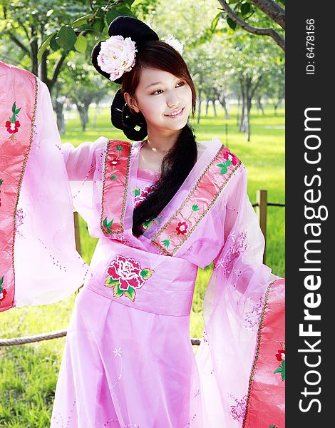 A girl in Chinese ancient dress. She is so beautiful and lovely. A girl in Chinese ancient dress. She is so beautiful and lovely.