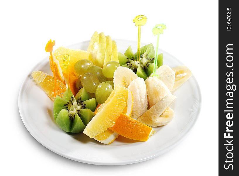 Fresh Sliced Fruit Plate (Banana, Kiwi, Pineapple, Apple, Grapes). Isolated on White Background