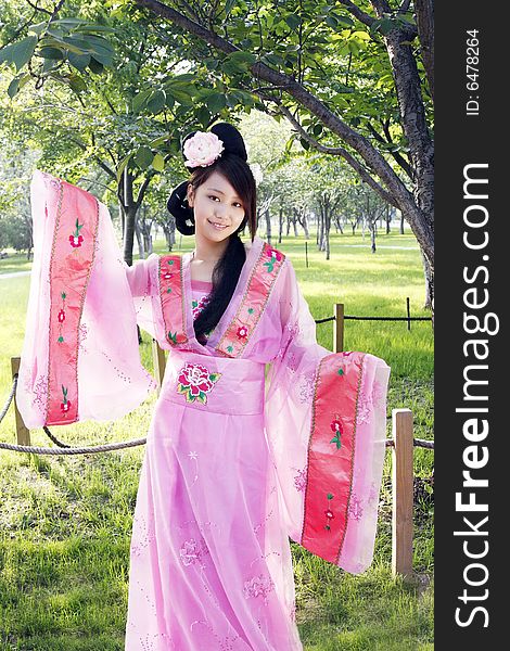 A girl in Chinese ancient dress. She is so beautiful and lovely. A girl in Chinese ancient dress. She is so beautiful and lovely.