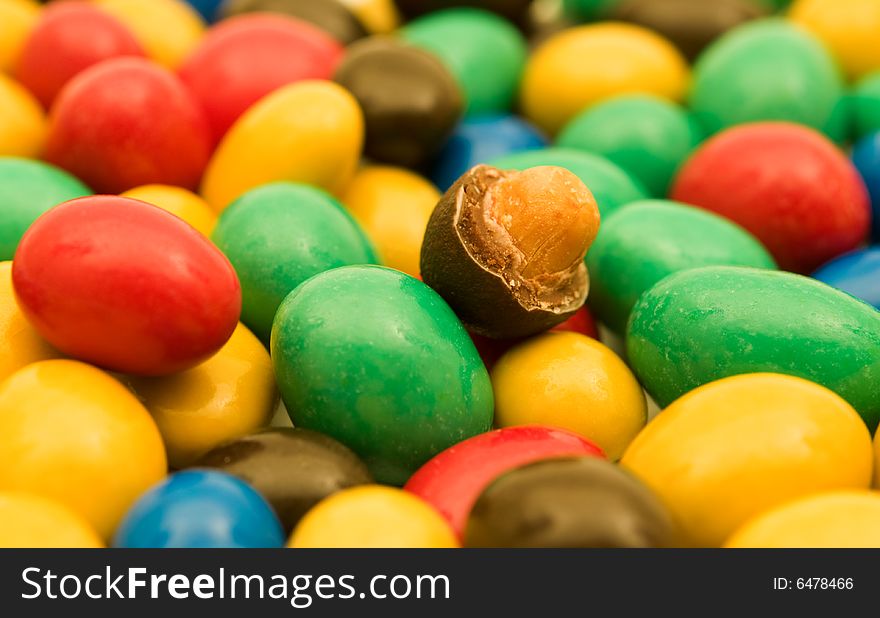 Colorful candies with a nut