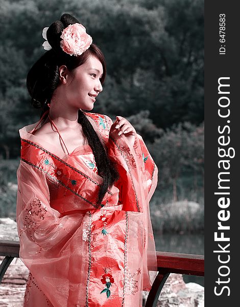 A girl in Chinese ancient dress. She is so beautiful and lovely. A girl in Chinese ancient dress. She is so beautiful and lovely.