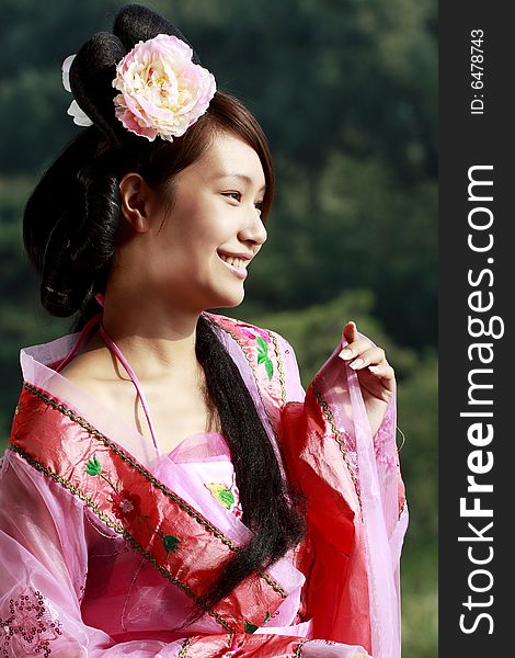 A girl in Chinese ancient dress. She is so beautiful and lovely. A girl in Chinese ancient dress. She is so beautiful and lovely.