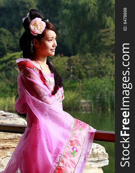 A girl in Chinese ancient dress. She is so beautiful and lovely. A girl in Chinese ancient dress. She is so beautiful and lovely.