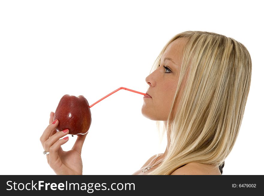 Woman drinking the fresh juice through the tube