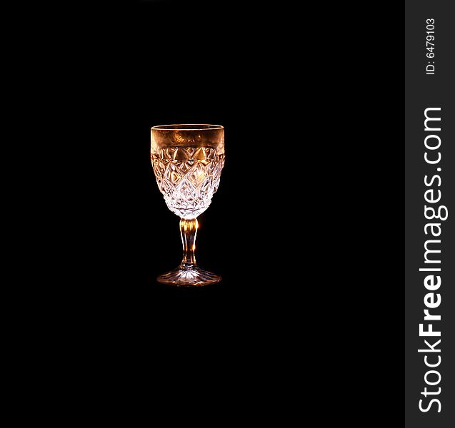 Glass in the black background with flash. Glass in the black background with flash