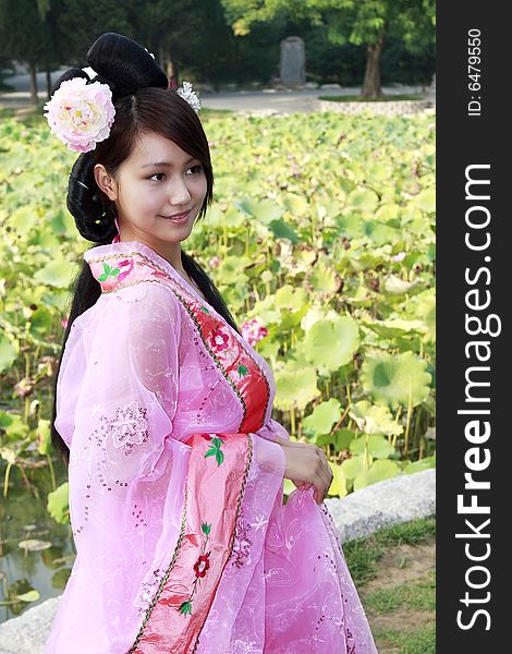 A girl in Chinese ancient dress. She is so beautiful and lovely. A girl in Chinese ancient dress. She is so beautiful and lovely.