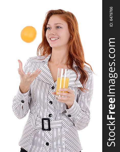 Portrait of a happy young pretty woman drink juice and   toss up an orange