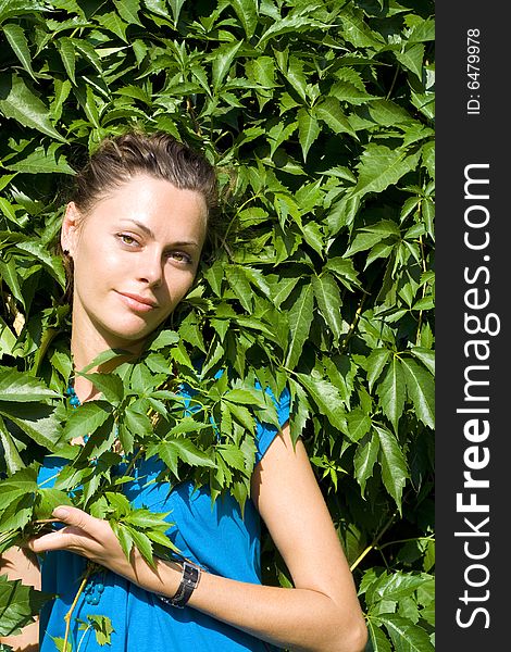 Smiling woman with green vine. Smiling woman with green vine