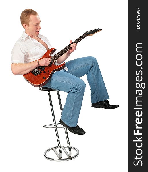 Young man play guitar on chair on white. Young man play guitar on chair on white