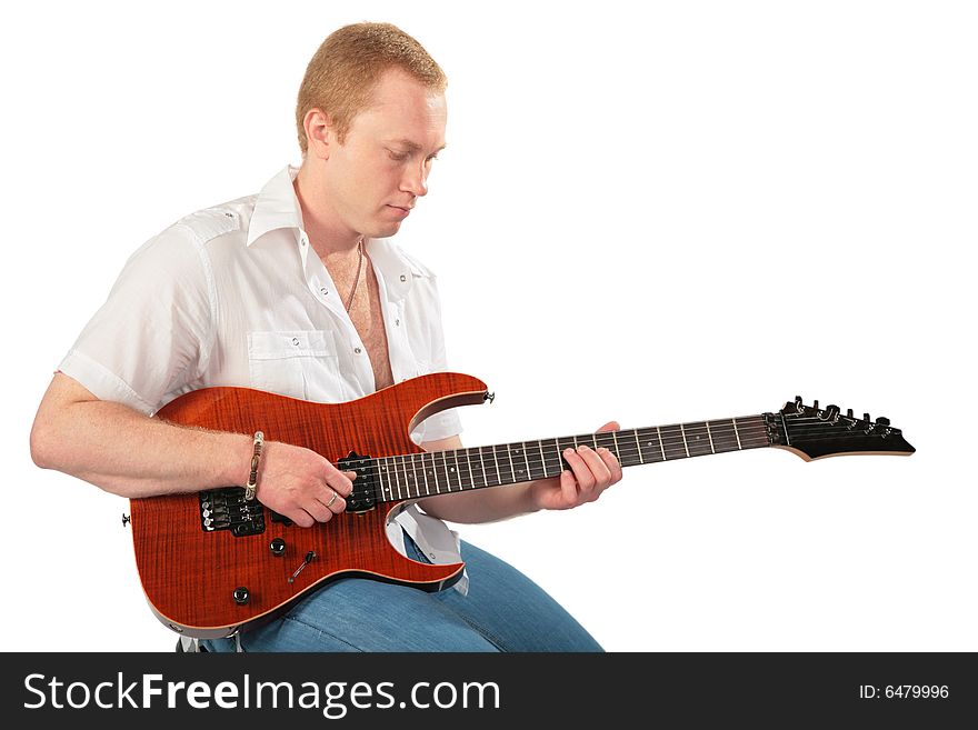 Young man with guitar on white