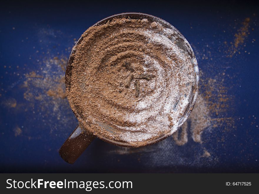 Big brown cup of cappucino on a blue background. Big brown cup of cappucino on a blue background